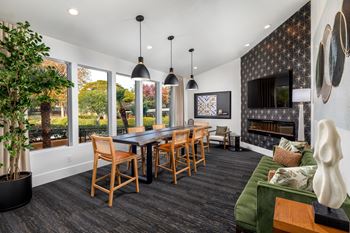 Living room with a table and chairs and a fireplace